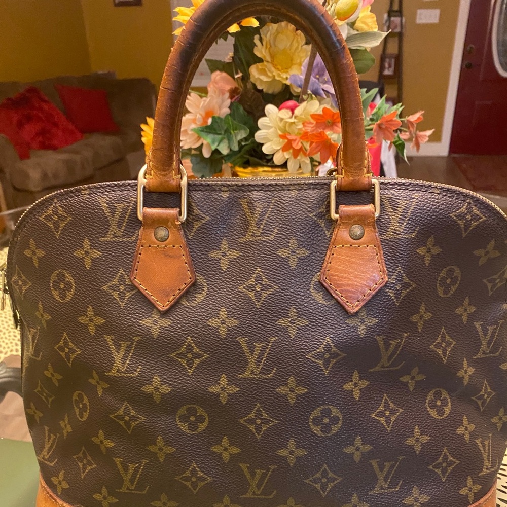 Louis Vuitton
Alma Pm Monogram Coated Canvas Satchel 12.5"L x 6.5"W x 9.5"H